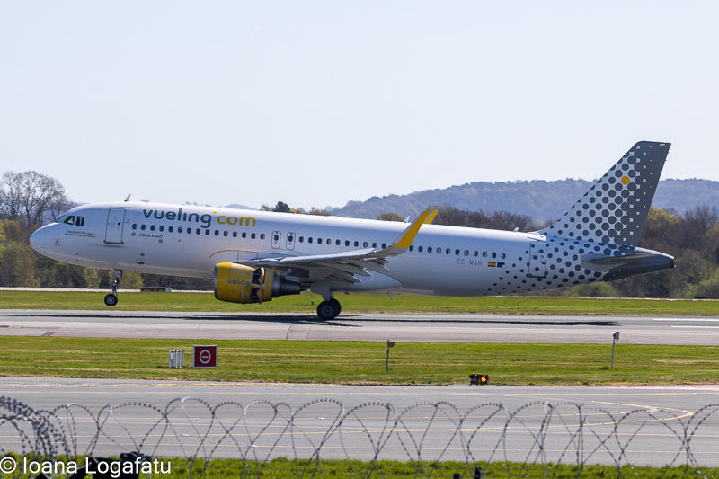 Vueling airplane landing on a sunny day